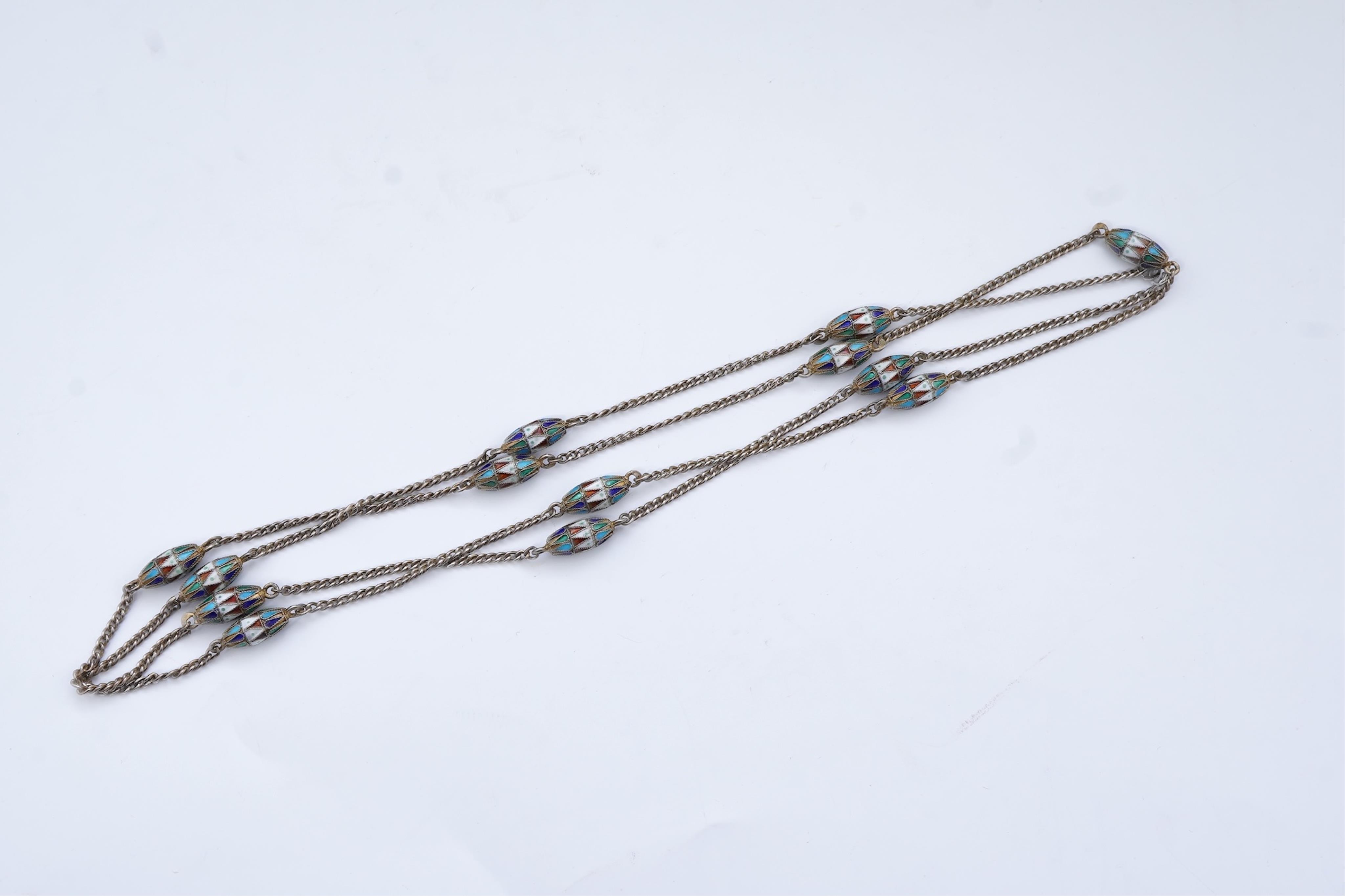 A silver and enamel long chain necklace, Russia, early 20th century